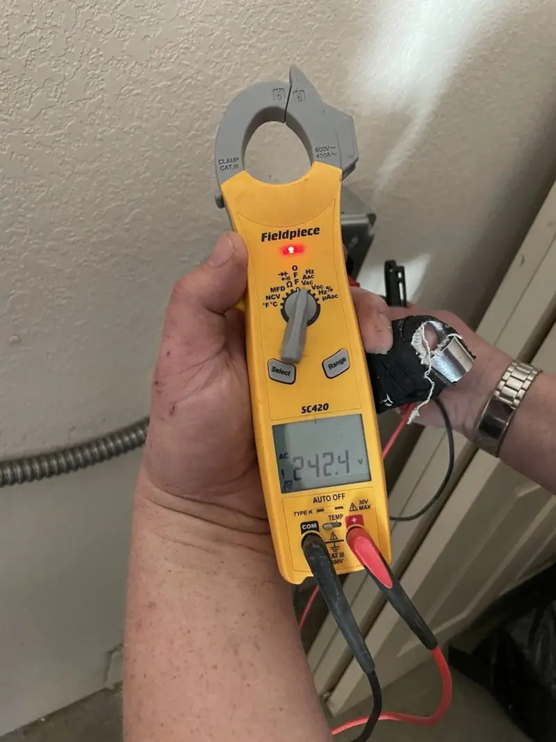 Voltage testing with clamp meter during Outlet Installation in Lower Gwynedd